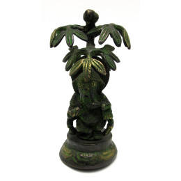 Ganesha bronze under a palm tree
