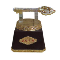 Golden key on a stand (12x10x12 cm)
